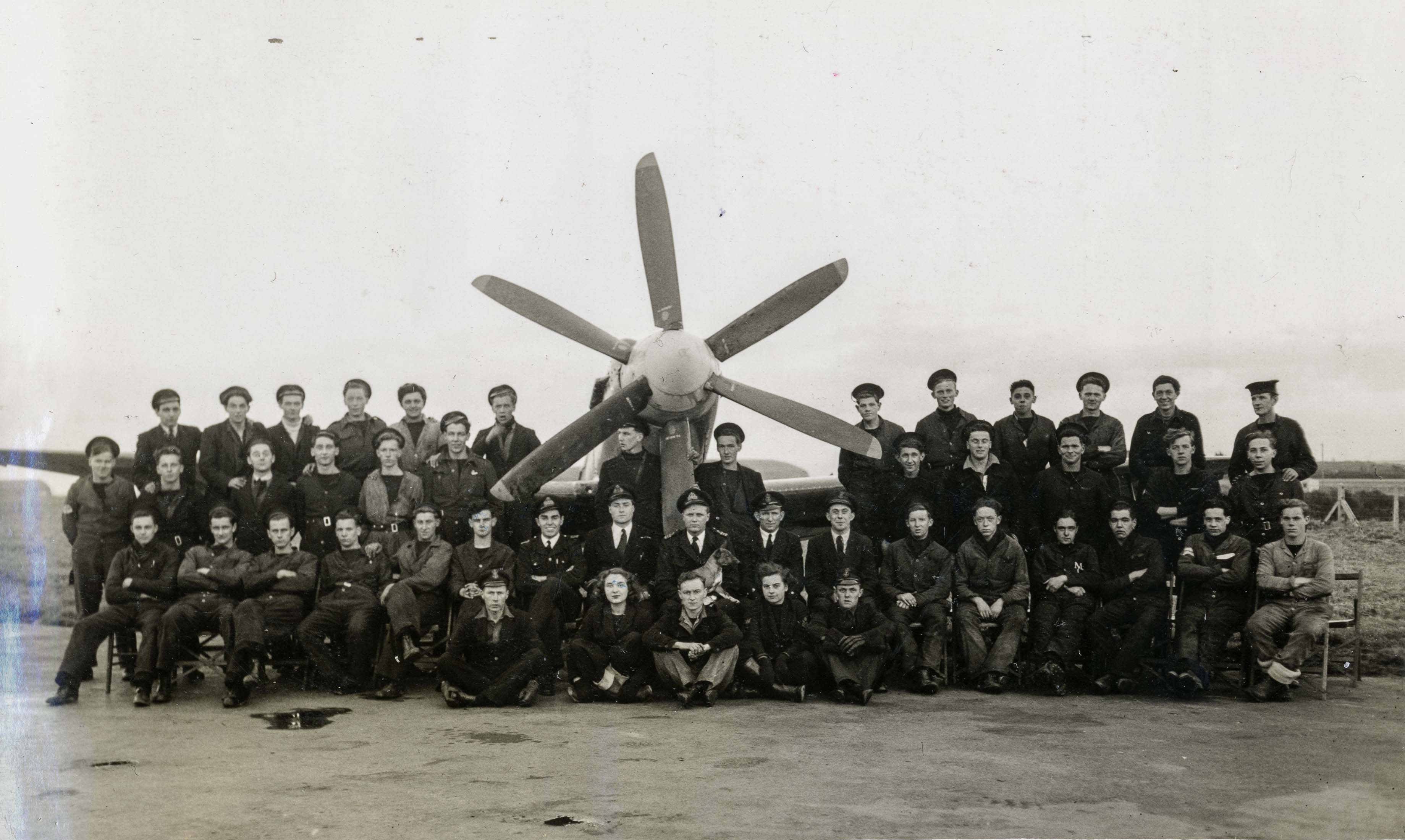  Lt Cdr D B Law seated centre 