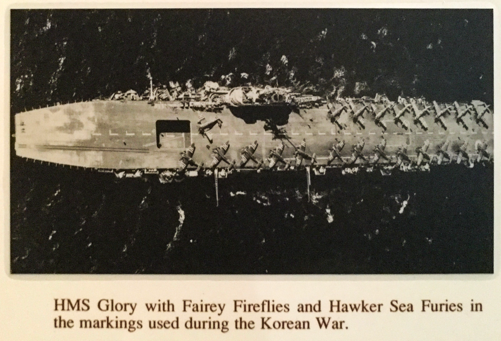  Aerial view of HMS Glory with Fairey Fireflies and Hawker Sea Furies on deck 